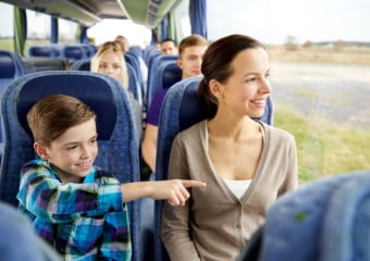 Woman and child happy to be on a sightseeing bus